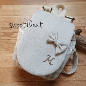 お名前刺繍入りリボンブローチベビーリュック（グレーチェック）