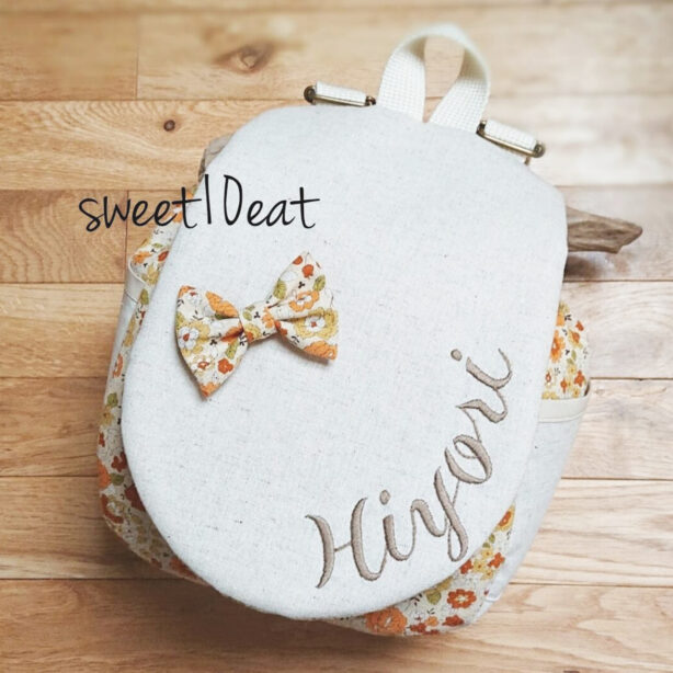 お名前刺繍入りリボンブローチベビーリュック （花柄　ナチュラオレンジ）